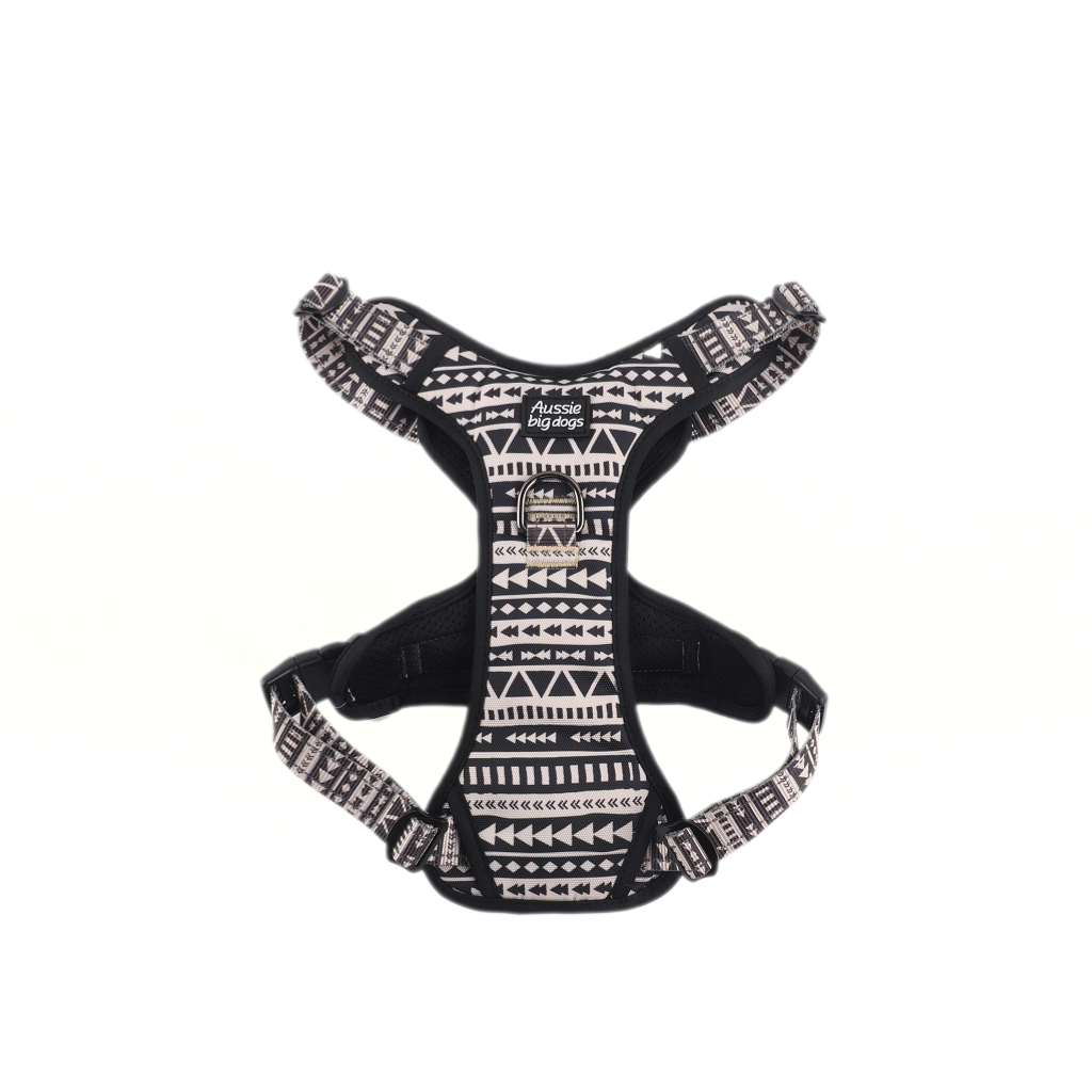 Black dog harness with white pattern on a white background