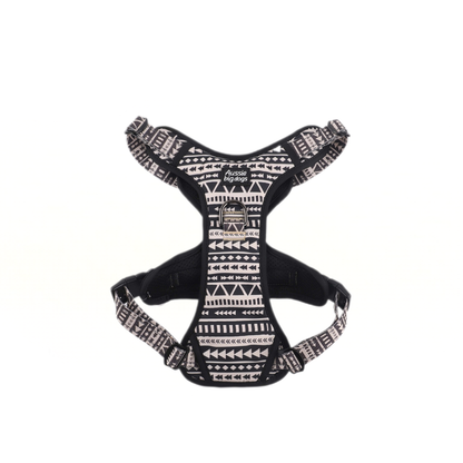 Black dog harness with white pattern on a white background