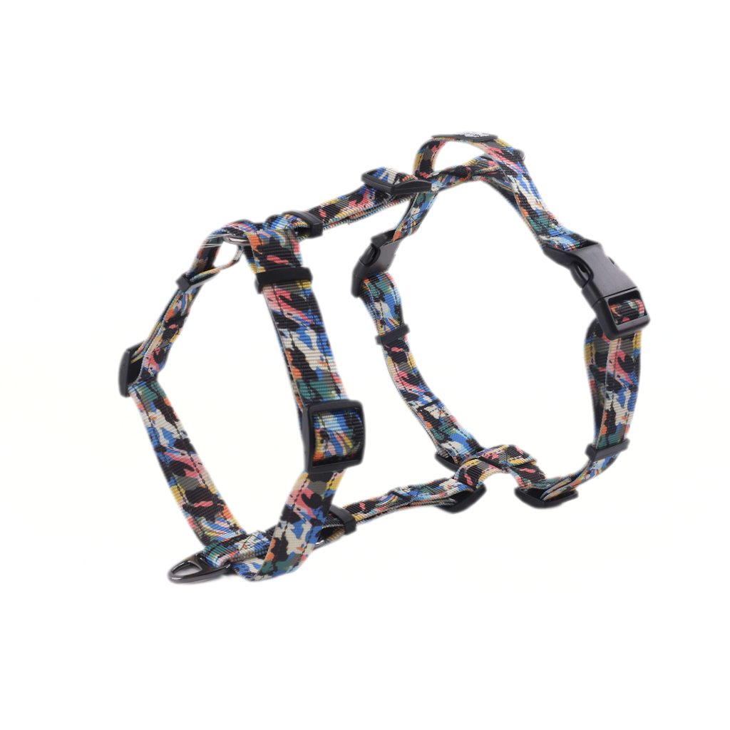 Colorful patterned dog harness on a white background
